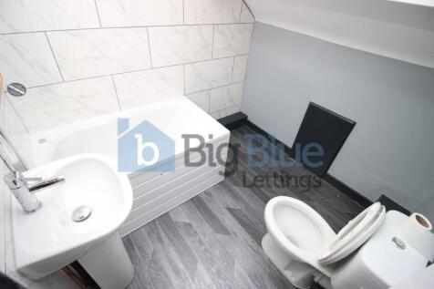 Bright and clean bathroom featuring a modern wh...