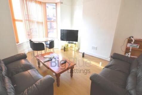 Bright and inviting living room featuring comfo...