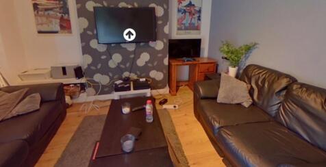 A cozy living room featuring two comfortable le...