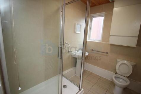 Bright and clean bathroom featuring a spacious ...