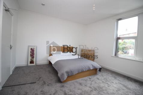 Bright and spacious master bedroom featuring a ...