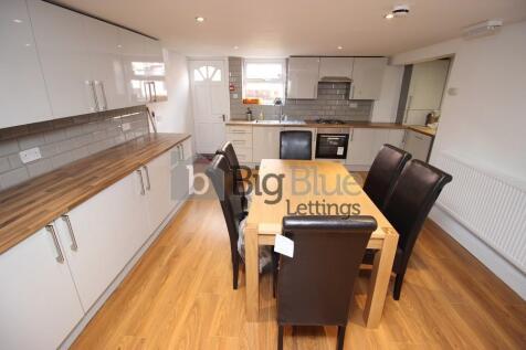 Bright and modern kitchen featuring ample cupbo...