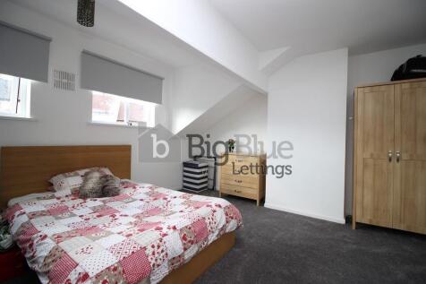 A cozy double bedroom featuring a comfortable d...