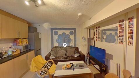 A cozy living room featuring a comfortable sofa...