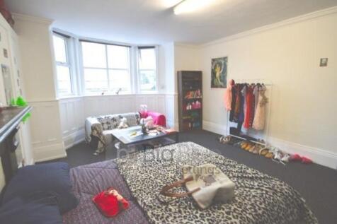 Bright and spacious master bedroom featuring a ...