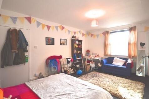 A spacious and inviting master bedroom featurin...