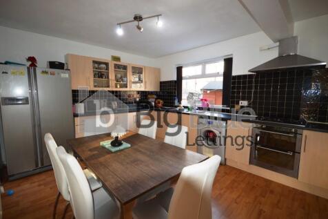 A modern, well-equipped kitchen featuring a spa...