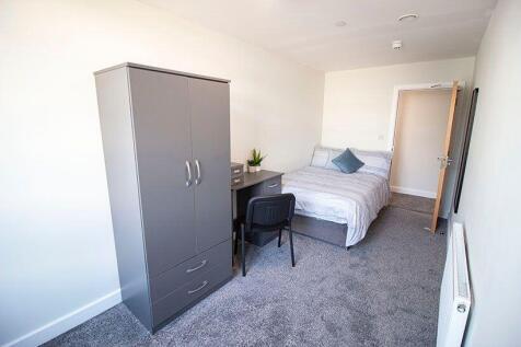 Bright and tidy double bedroom featuring a comf...