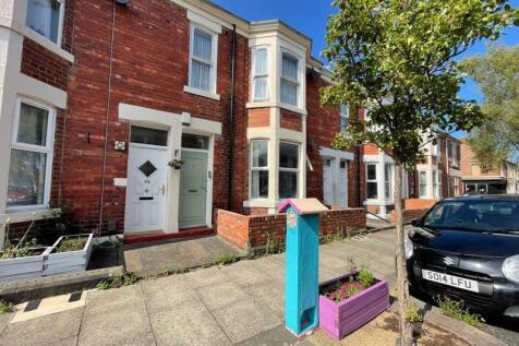 Bright and well-maintained terraced house front...