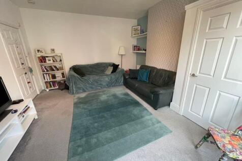 A cozy and inviting living room featuring comfo...