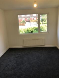 Bright and clean single bedroom featuring a lar...