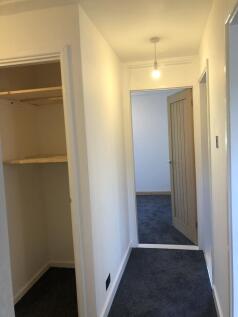 Bright and clean hallway featuring fresh white ...