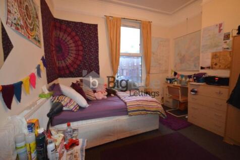 Cozy single bedroom with a comfortable bed, dec...