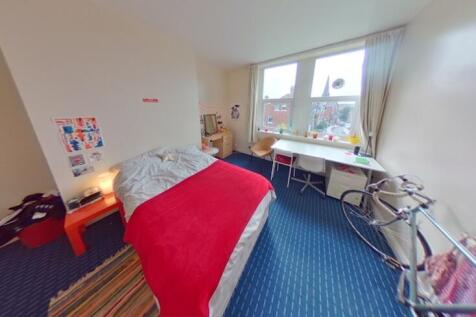 A clean and well-lit small room featuring a sin...