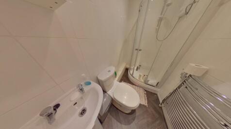A clean and modern bathroom suite featuring a w...