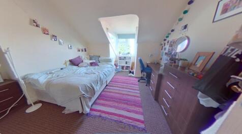 A bright and clean single toilet room featuring...