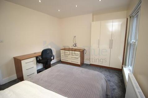 Bright and tidy double bedroom featuring a larg...