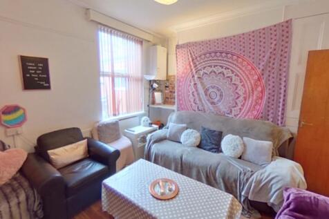 Bright and cozy living room featuring comfortab...