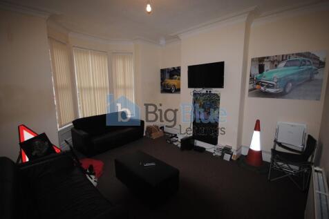 A cozy living room featuring a comfortable sofa...