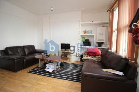 A cozy and well-kept living room featuring two ...