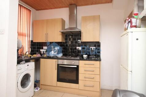 A compact and functional kitchen featuring mode...