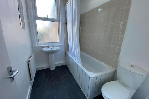 Bright and clean bathroom featuring a full bath...