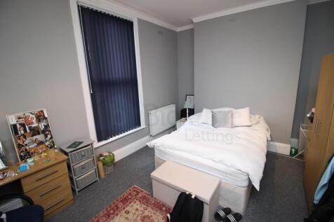 Bright and cozy double bedroom featuring a comf...