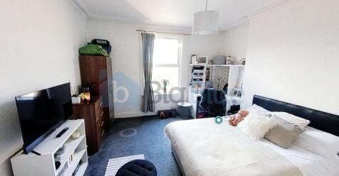 Bright and spacious master bedroom featuring a ...