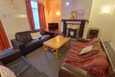 A warm and inviting living room featuring comfo...