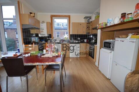 Bright and spacious kitchen with ample cabinetr...
