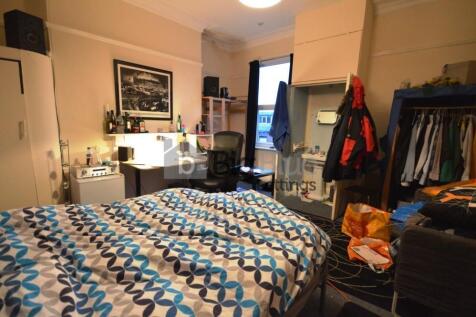 Cozy double bedroom featuring a comfortable bed...