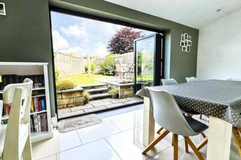 A bright and modern living room with large glas...