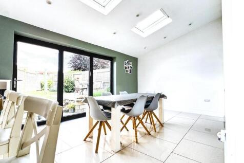 Bright and airy living room featuring modern fu...