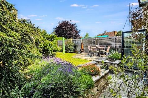 A bright and inviting garden space featuring lu...