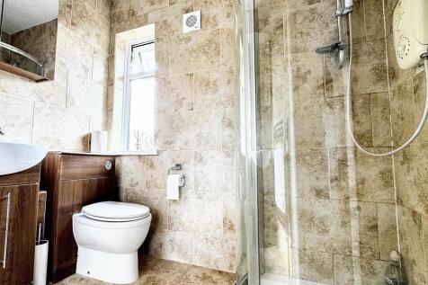 A stylish and well-maintained bathroom suite fe...