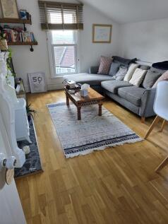 Bright and inviting living room featuring a coz...