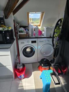 A bright and functional laundry room with moder...