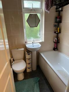 Bright and well-maintained bathroom featuring a...