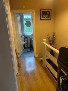 A clean and well-maintained hallway with polish...