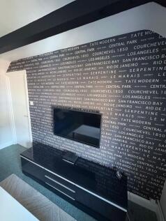 A modern living room featuring a sleek black me...