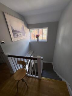 A clean and well-maintained staircase area with...