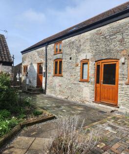 Charming stone-fronted terraced house with warm...