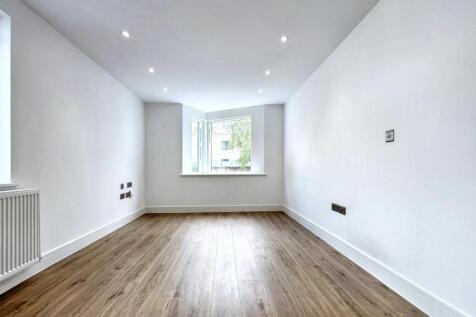 Bright and spacious master bedroom featuring sl...