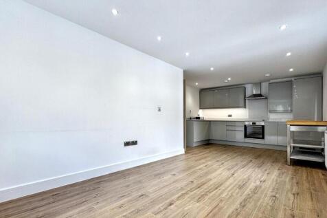 A bright and spacious modern living room with a...