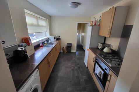 A neat and functional kitchen with ample cabine...