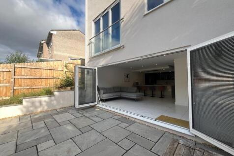 A modern living room seamlessly connected to a ...