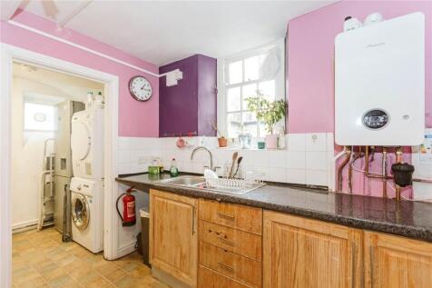 Bright and well-maintained kitchen featuring wo...