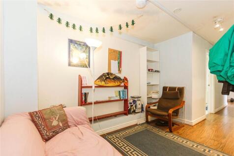 A cozy living room featuring a comfortable sofa...