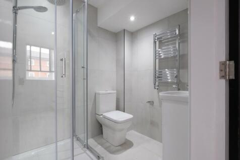 A modern and stylish bathroom featuring a spaci...