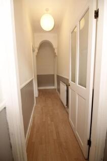 A clean and well-maintained hallway featuring l...